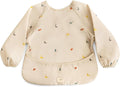 mushie Long Sleeve Baby Bib | Water Resistant Adjustable Fit for Ages 6-24 Months