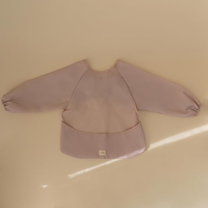 mushie Long Sleeve Baby Bib | Water Resistant Adjustable Fit for Ages 6-24 Months