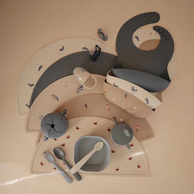 mushie Silicone Baby Bib | Adjustable Fit Waterproof Bibs (Rocket Ship)