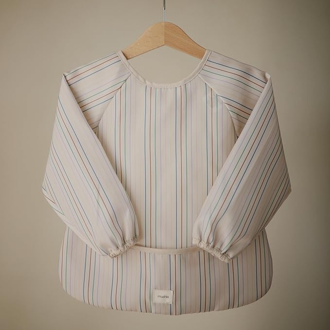 mushie Long Sleeve Baby Bib | Water Resistant Adjustable Fit for Ages 6-24 Months