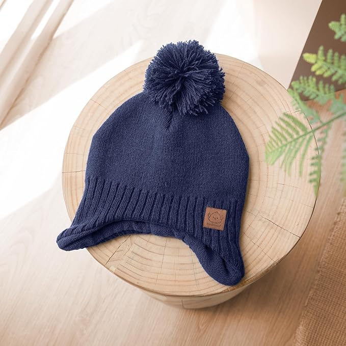 Baby Beanies, Baby Hats for Boys, Girls - Cute Toddler Winter Hat, Soft & Stretchy Beanies for Infant, Newborn 6-36 Months, Cozy & Warm with Earflap Muff & Pom (Taupe)